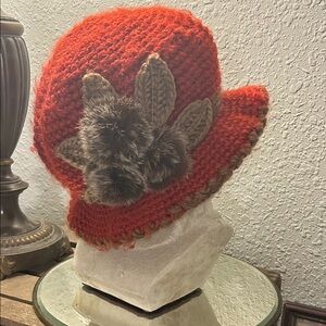 Cool weather Orange knit hat with brown faux fur pompoms